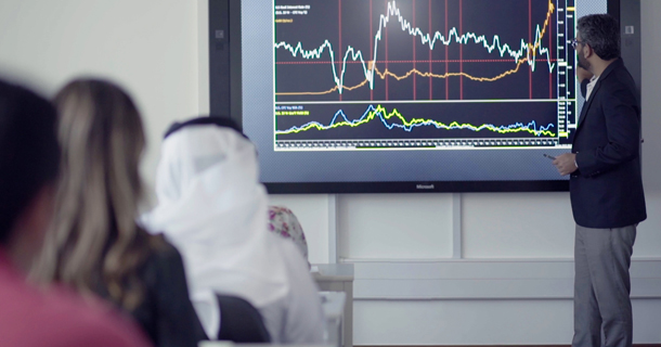 Image of a faculty using technology in the classroom in Dubai Campus of Abu Dhabi University