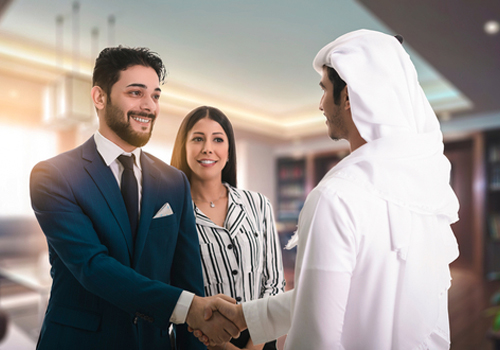 Two men shaking hands on a deal after using skills gained in the Doctor of Business Administration course