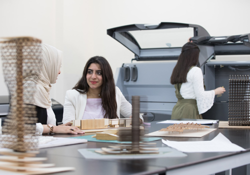 Two female students completing their Bachelor of Architecture degree having a discussion